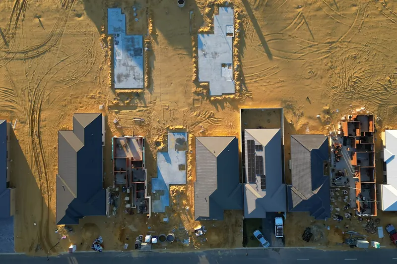 Aerial view of a new-construction lot cleared and graded in Litchfield County